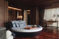 a bedroom with a large bed in a room at Keemala in Kamala Beach
