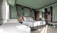 Postel nebo postele na pokoji v ubytování Hua Hin Habitat Hotel- SHA Extra Plus