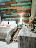 A bed or beds in a room at Hotel Efyra
