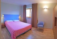 Posteľ alebo postele v izbe v ubytovaní Teresa Campi Apartments Lake view by Gardadomusmea