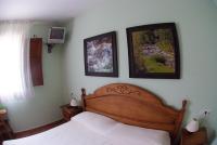 A bed or beds in a room at Hotel Casa Duaner