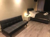 A seating area at DISTRiCT 01-Luxury Urban Lofts