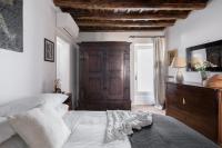 A bed or beds in a room at Classic and chic apartments in Trastevere