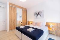 Postel nebo postele na pokoji v ubytování Apartments Fiorello