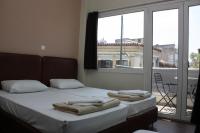 Postel nebo postele na pokoji v ubytování Pella Inn Hostel