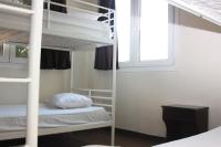 Postel nebo postele na pokoji v ubytování Pella Inn Hostel