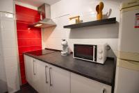 A kitchen or kitchenette at Cuencaloft el balcon de Ali