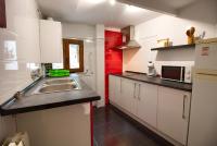 A kitchen or kitchenette at Cuencaloft el balcon de Ali