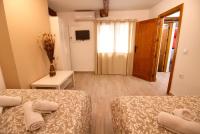 A bed or beds in a room at Cuencaloft el balcon de Ali