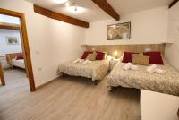 A bed or beds in a room at Cuencaloft el balcon de Ali