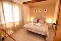 A bed or beds in a room at Cuencaloft el balcon de Ali
