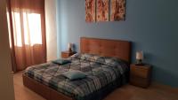 A bed or beds in a room at Sandalia B&B