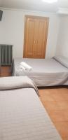 Postel nebo postele na pokoji v ubytování Plaza de España