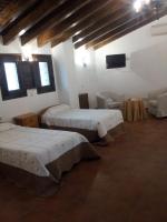 Postel nebo postele na pokoji v ubytování Posada Villa Maria
