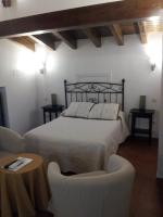 Postel nebo postele na pokoji v ubytování Posada Villa Maria