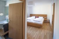 Łóżko lub łóżka w pokoju w obiekcie Grossglockner Alpin Lodge
