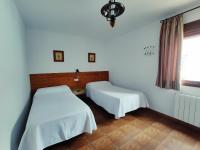 Łóżko lub łóżka w pokoju w obiekcie Complejo Apartamentos Rurales Molino de Abajo