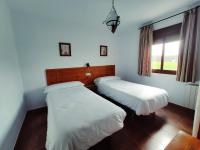 Łóżko lub łóżka w pokoju w obiekcie Complejo Apartamentos Rurales Molino de Abajo