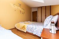 Posteľ alebo postele v izbe v ubytovaní Apartman Monika