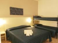 Łóżko lub łóżka w pokoju w obiekcie Hotel Atmosfere Beach