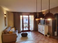 A television and/or entertainment centre at Spazioso appartamento con terrazza a due passi dal centro