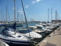 a group of boats docked in a harbor at valras appartement T2 proche mer et port in Valras-Plage