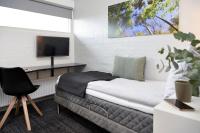 TV a/nebo společenská místnost v ubytování HORISONT Hotel & Konference