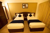Hotel Guruvayur Darshanにあるベッド