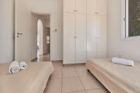 Postel nebo postele na pokoji v ubytování Bungalow Casa Bonita by Ezoria Villas
