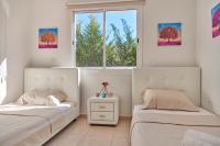Postel nebo postele na pokoji v ubytování Bungalow Casa Bonita by Ezoria Villas