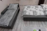 Postel nebo postele na pokoji v ubytování HIGH STREET APARTMAN