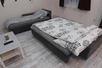 Postel nebo postele na pokoji v ubytování HIGH STREET APARTMAN