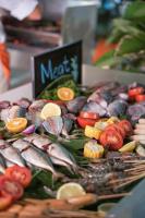 a plate of food with seafood and vegetables at HARRIS Hotel Batam Center in Batam Center