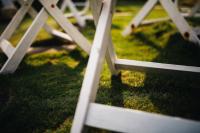 a close up of a picnic table in the grass at Blue Lagoon in Huxi