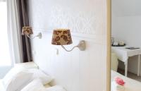 Een bed of bedden in een kamer bij Hotel 't Witte Huys Scheveningen