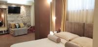 Televízia a/alebo spoločenská miestnosť v ubytovaní Authentic Luxury Rooms