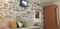 Televízia a/alebo spoločenská miestnosť v ubytovaní Authentic Luxury Rooms