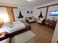 Posteľ alebo postele v izbe v ubytovaní Etno Garden Exclusive Rooms