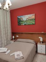 Posteľ alebo postele v izbe v ubytovaní Apartamentos Casa Sardina