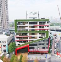 an office building with a vertical garden on top of it at Icloud Luxury Resort &amp; Hotel in Taichung