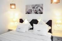 Łóżko lub łóżka w pokoju w obiekcie Hotel Ottaviano