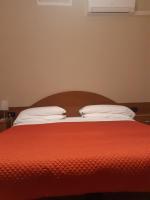 A bed or beds in a room at Hotel Due Gemelli
