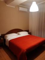 A bed or beds in a room at Hotel Due Gemelli