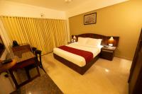Hotel Guruvayur Darshanにあるベッド
