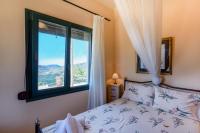 A bed or beds in a room at Best View Mountain Villa