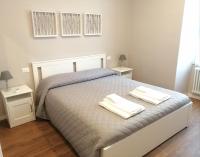 Posteľ alebo postele v izbe v ubytovaní Bixio Suites