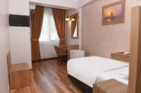A bed or beds in a room at Hotel Grand Umit