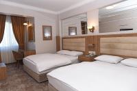 A bed or beds in a room at Hotel Grand Umit