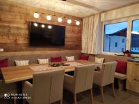 A television and/or entertainment centre at Alp-IN Lodges Kaprun