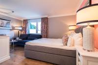 Postel nebo postele na pokoji v ubytování Hotel Norderriff